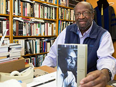 Professor James A. Miller in his English Department office